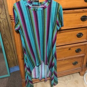 Crazy train top. Short in front, long in back. Size medium